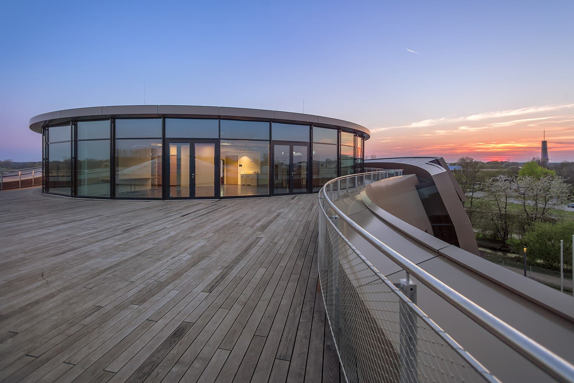 The building at sunset, shaped after two binary star systems