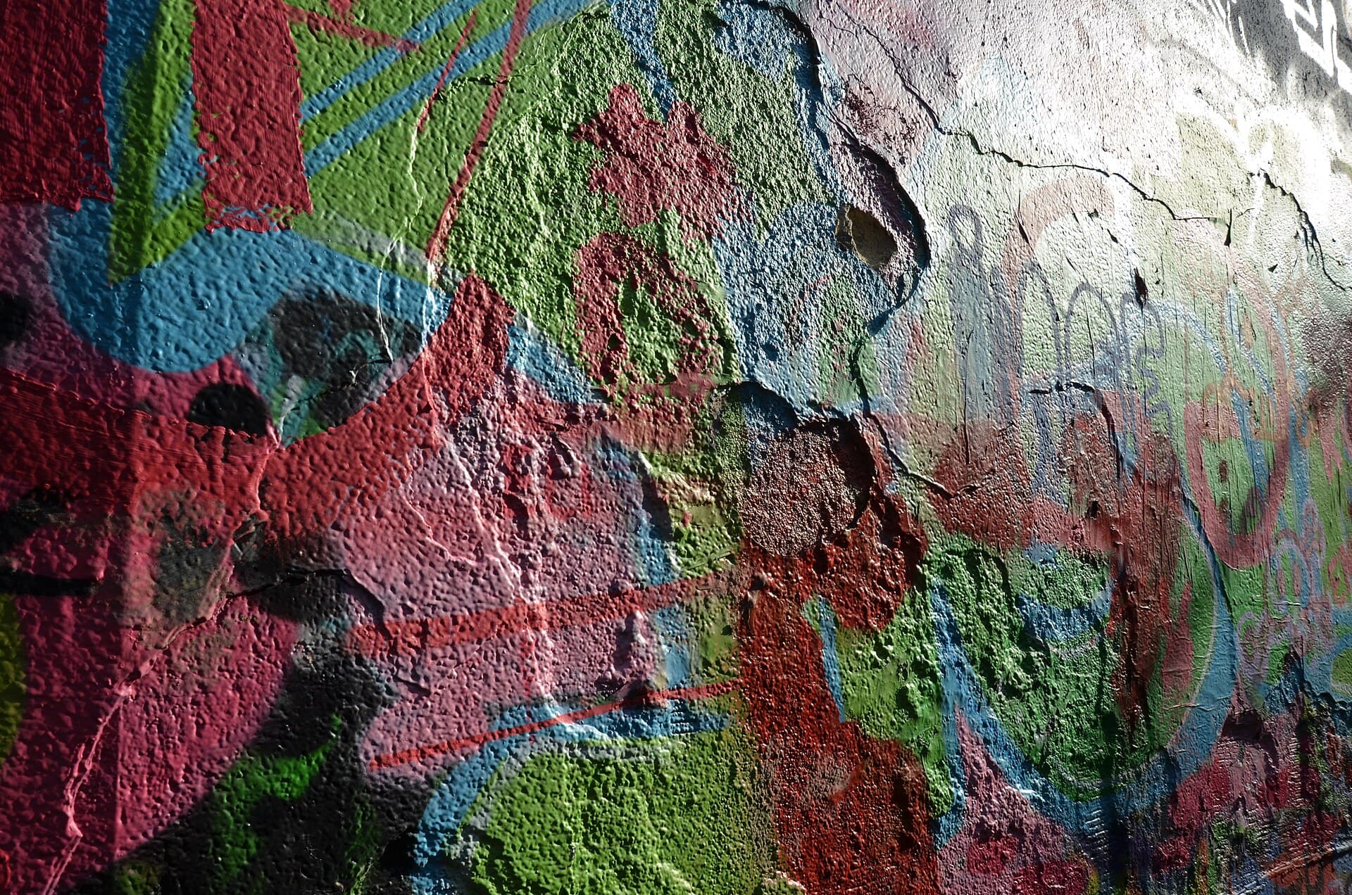 Layers of street art in Graffiti Street, Ghent