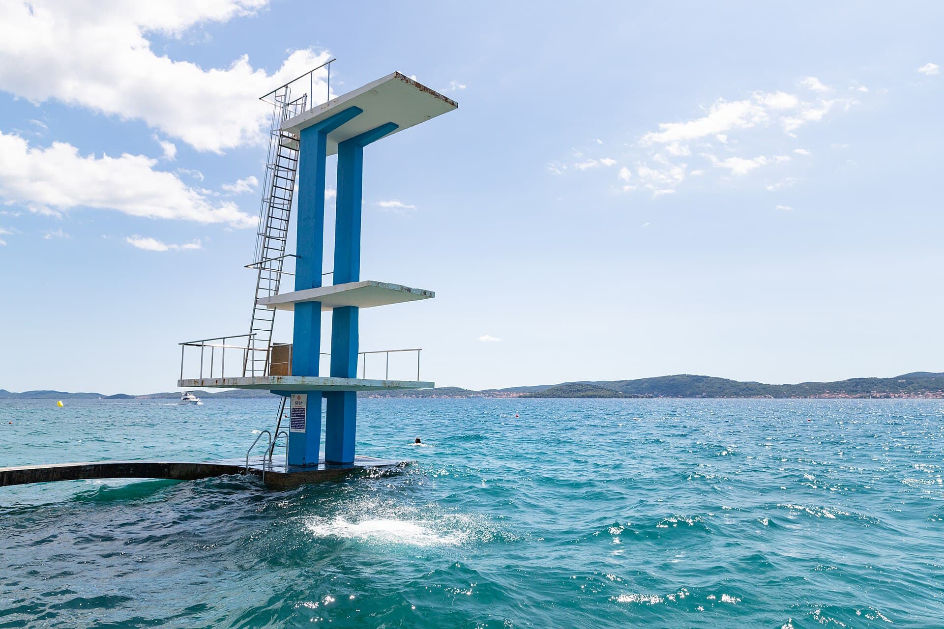 The diving tower in the sea off the beach