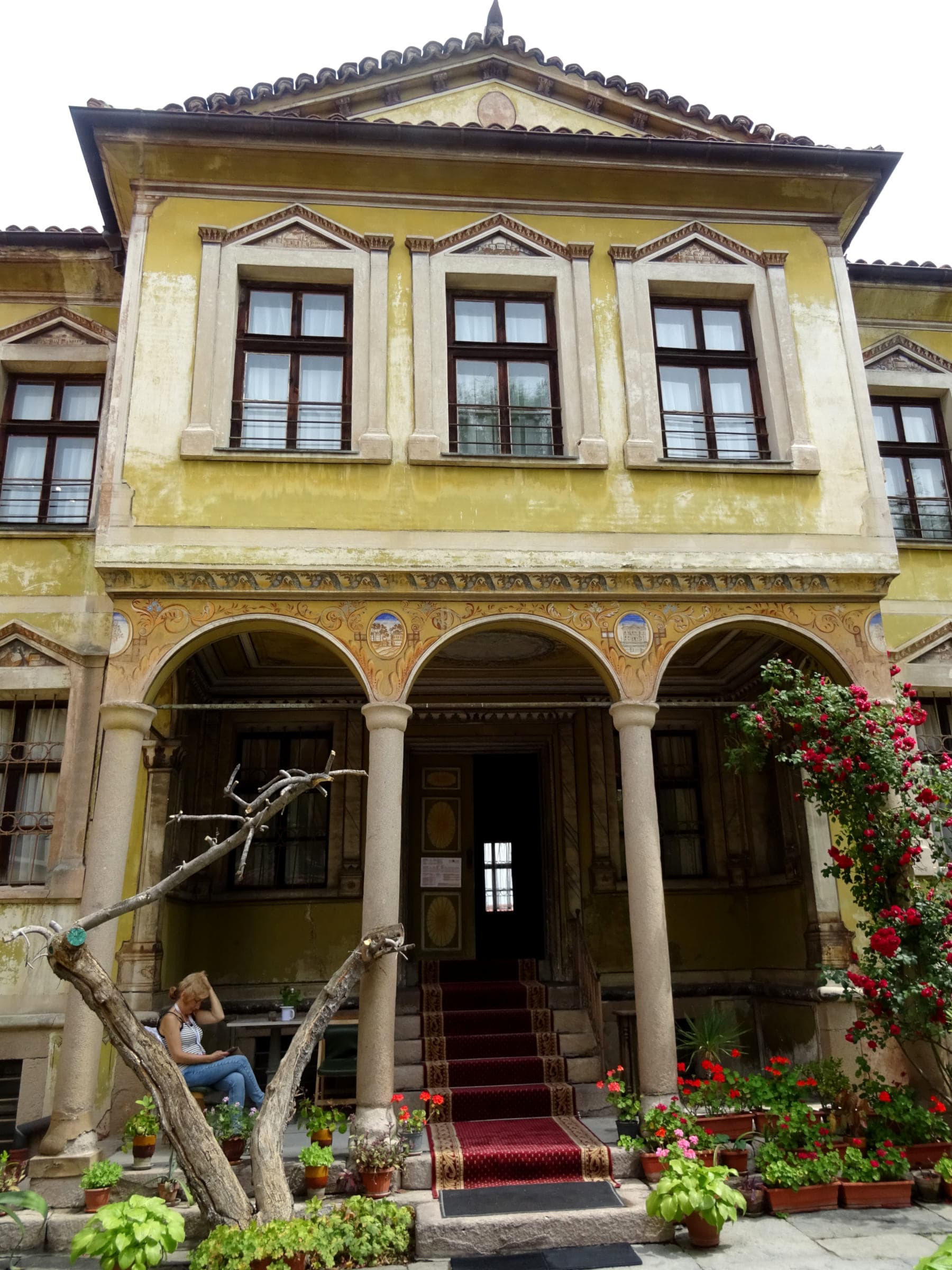 The upper floors overhanging the street