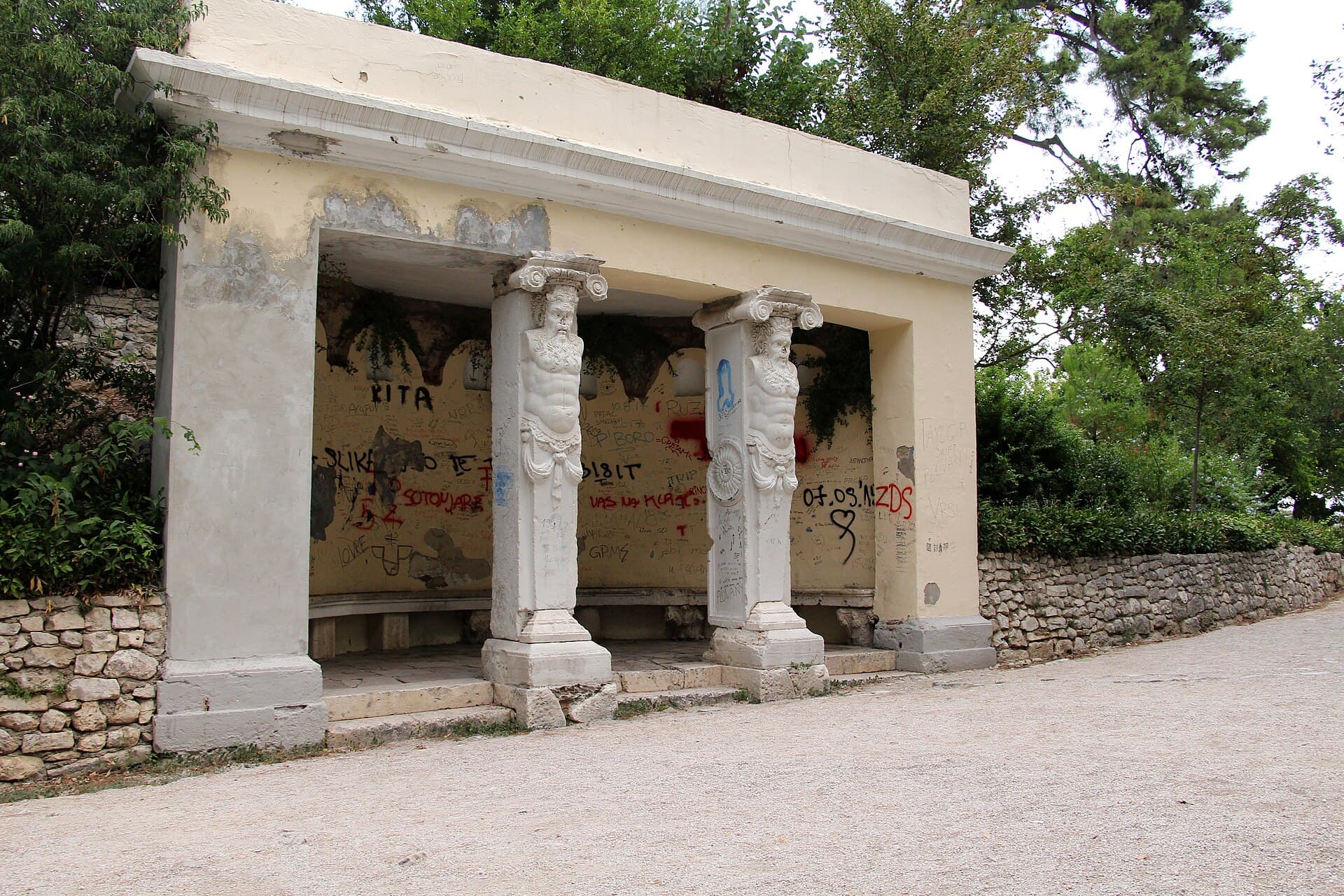 The park's seating pavilion, its columns carved as male figures