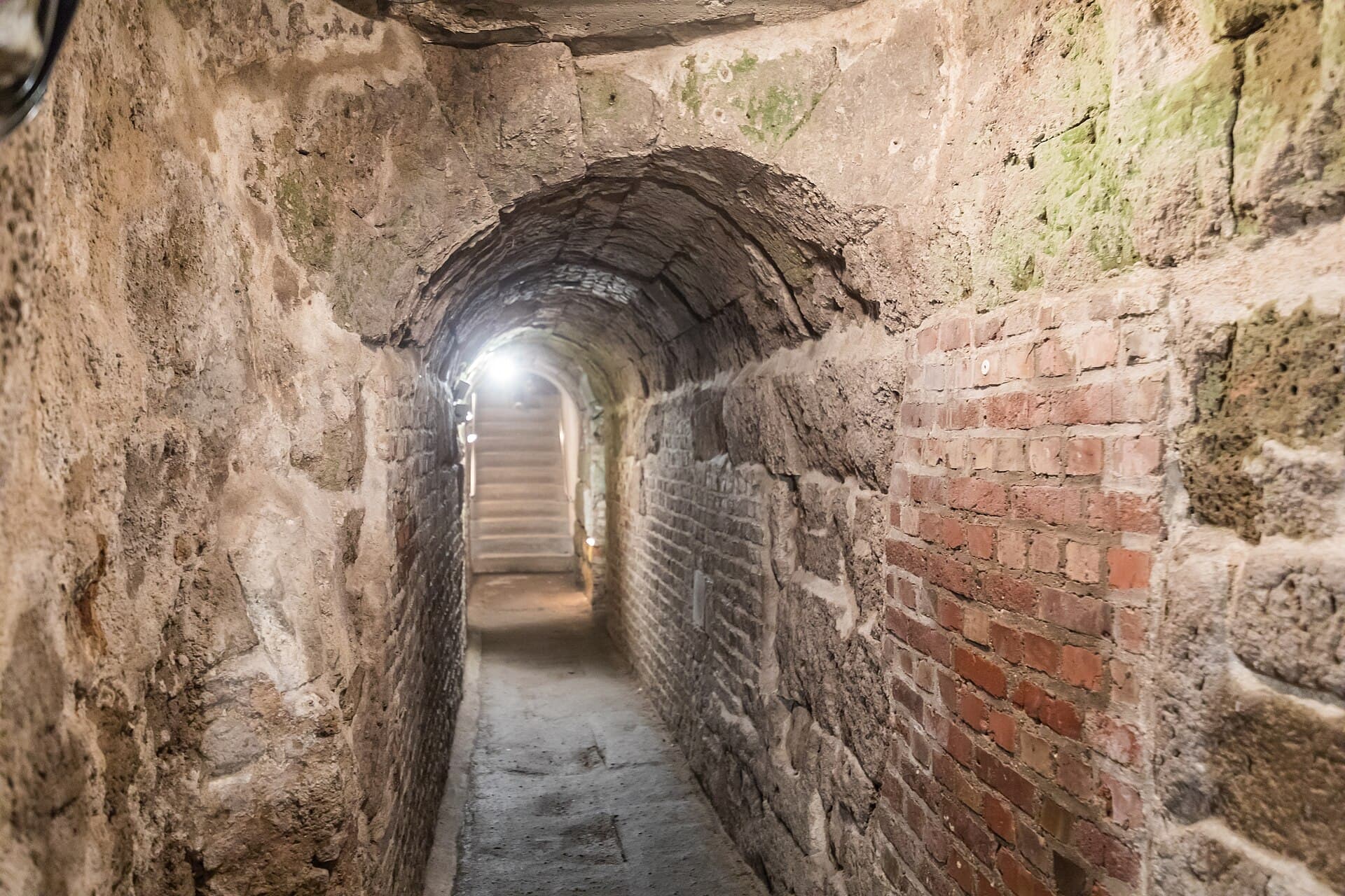 The vaulted passage in its original Roman stone