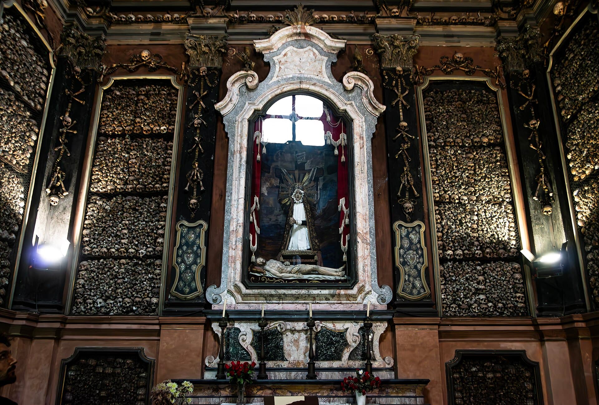 The ossuary altar and its bone-clad walls, Milan